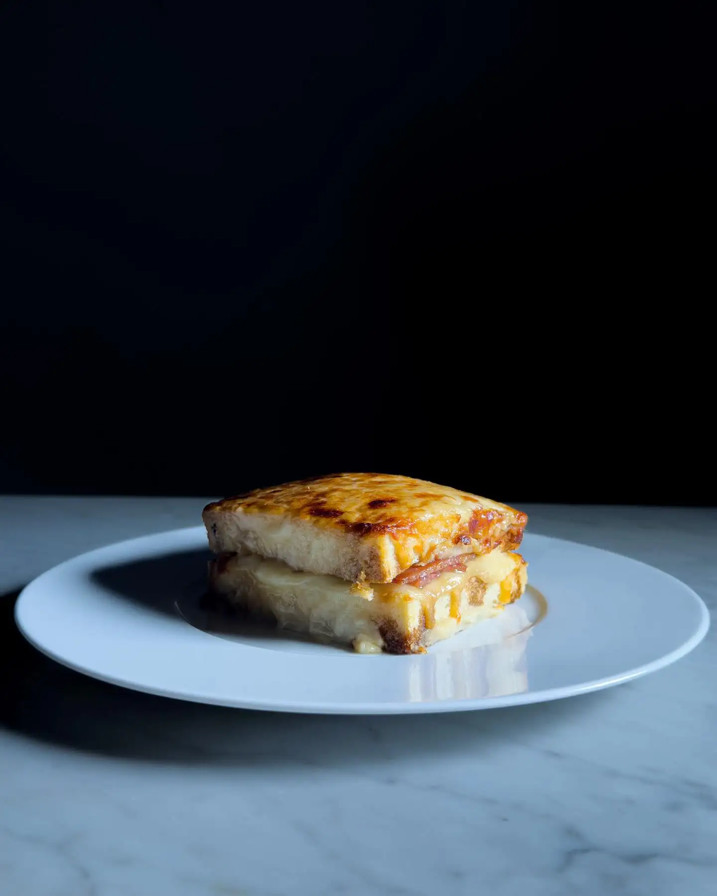 Come to try our signature dish and cocktail:

Croque monsieur [ca-ri-co], artisan mortadella, Parmesan fondue.

Arantius Siesta: Montelobos Mezcal, Tio Pepe Fino Sherry, orange, sesame.

#CaricoMilano #staycarico